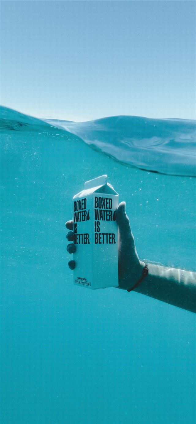1125x2436 person holding boxed water underwater - ocean iPhone 11 Wallpaper