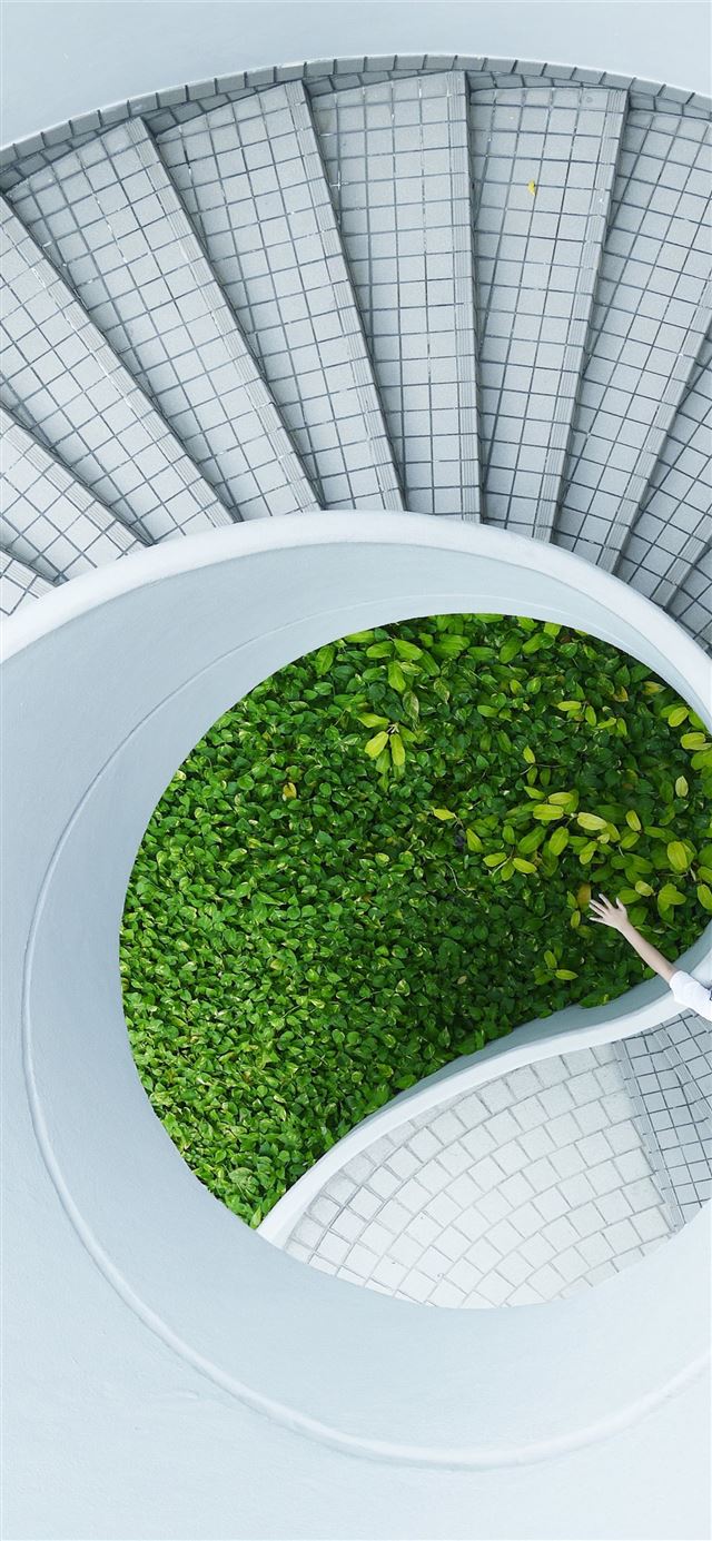 1125x2436 woman standing spiral stairs -  iPhone 11 Wallpaper