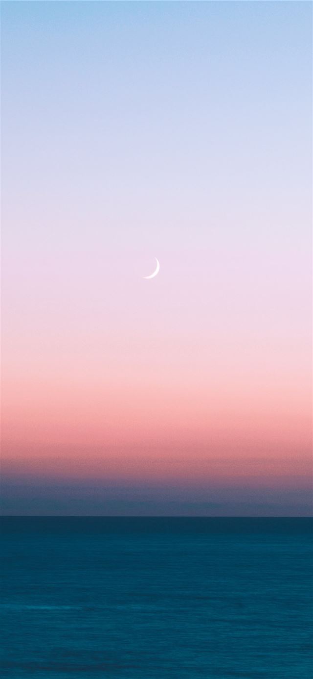 1125x2436 blue sea under white sky during daytime - france iPhone 11 Wallpaper
