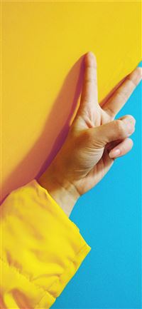 person doing peace hand sign iPhone 11 wallpaper