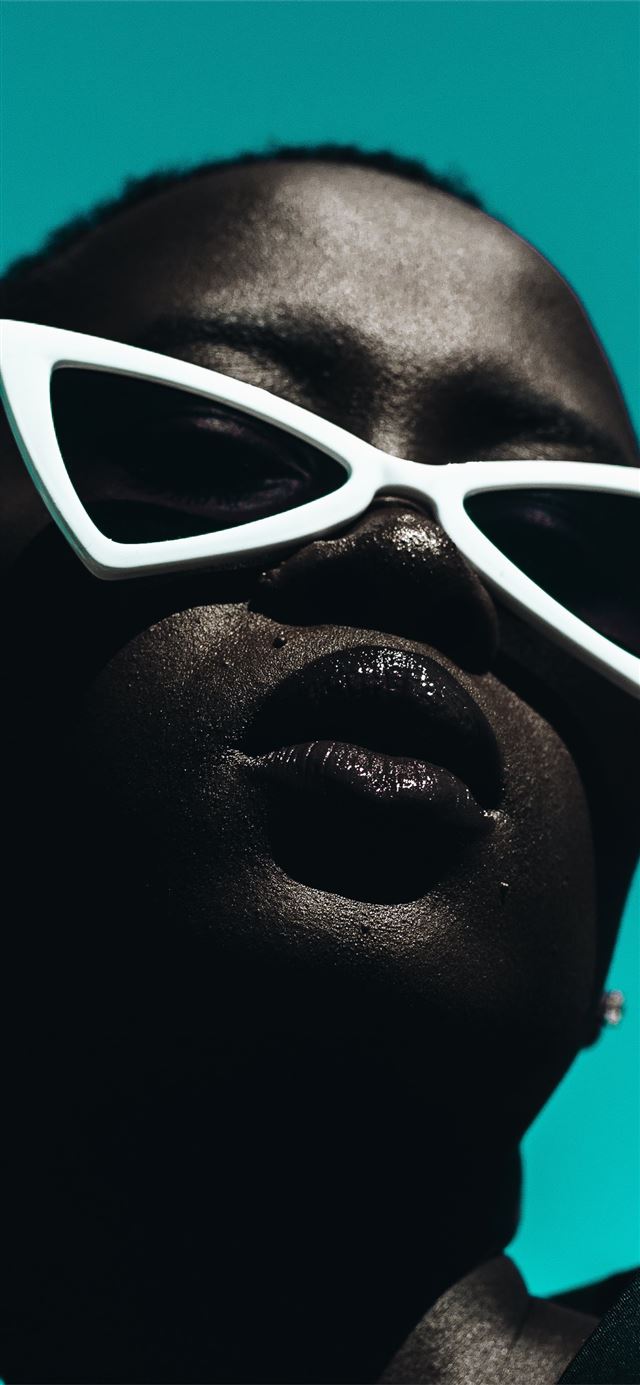 1125x2436 woman wearing white framed edgy sunglasses - cyan iPhone 11 Wallpaper