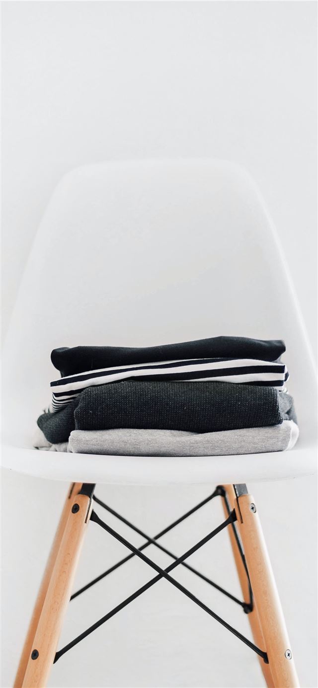 1125x2436 pile of black white and gray textiles on white pad... - website iPhone 11 Wallpaper
