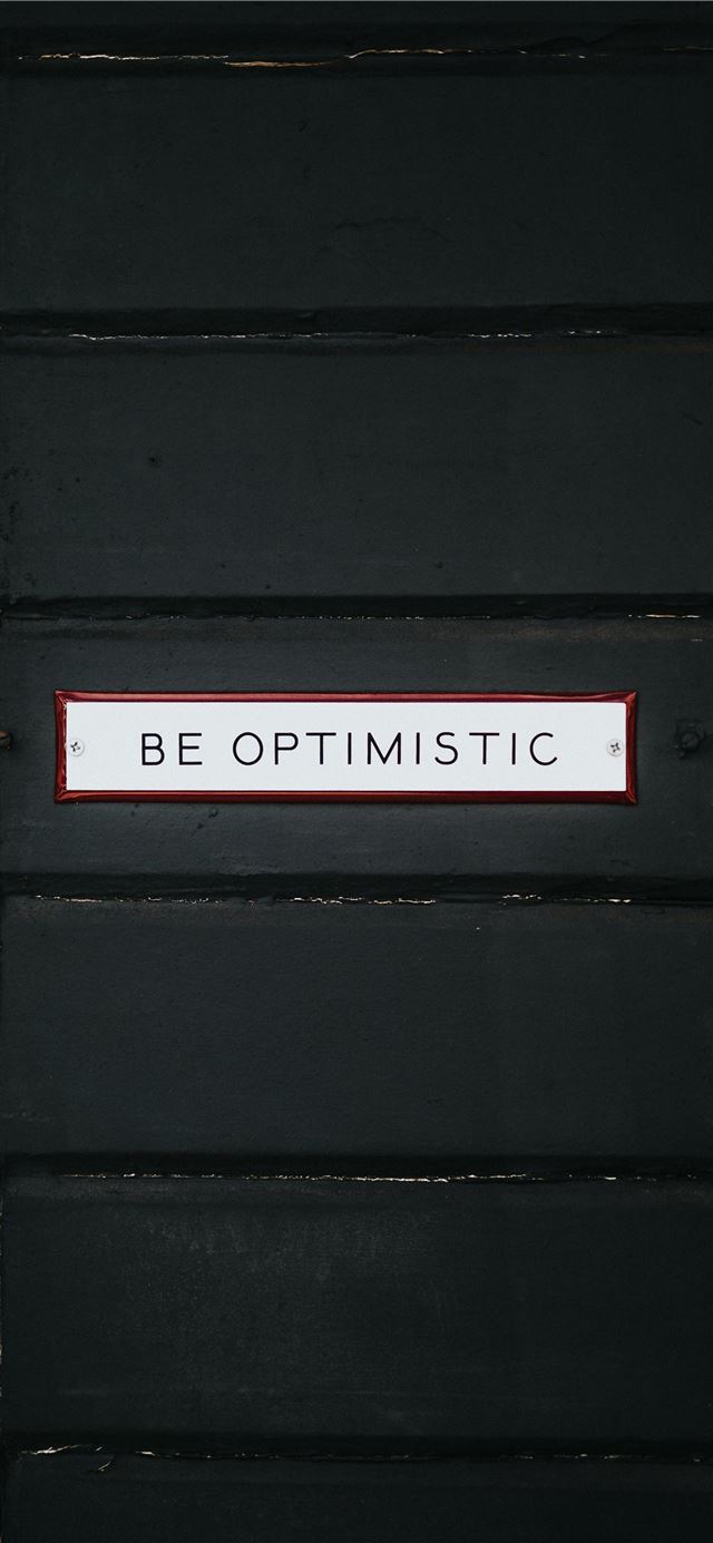 1125x2436 black wooden door with be optimistic text overlay - inspirational iPhone 11 Wallpaper