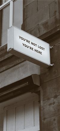 white and black signage wallpaper