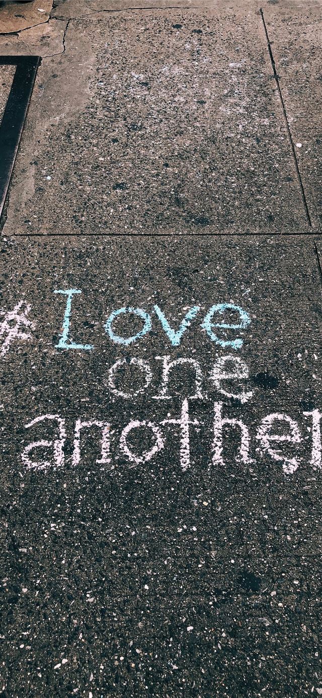 1125x2436 love one another chalk written on concrete floor - quotes iPhone 11 Wallpaper