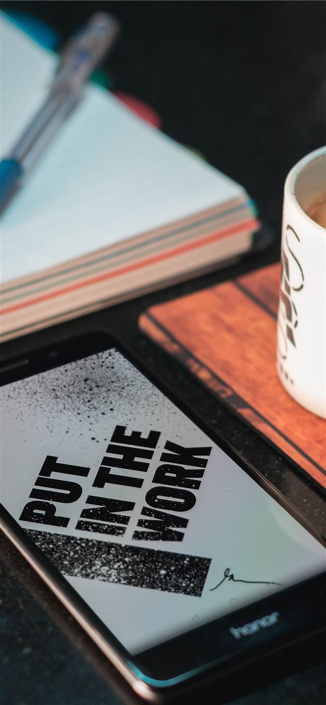 1125x2436 Honor smartphone beside mug and paper with pen - coffee iPhone 11 Wallpaper