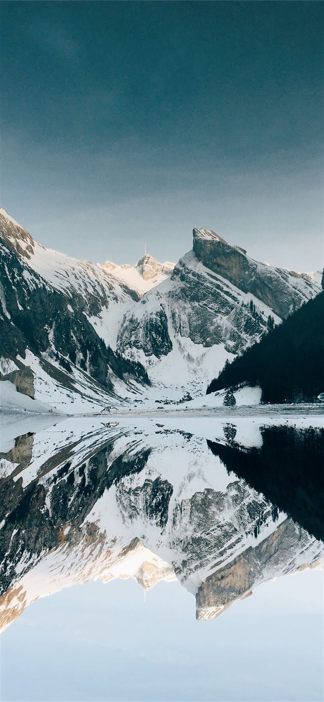 1125x2436 snow covered mountain near lake under blue sky - schweiz iPhone 11 Wallpaper