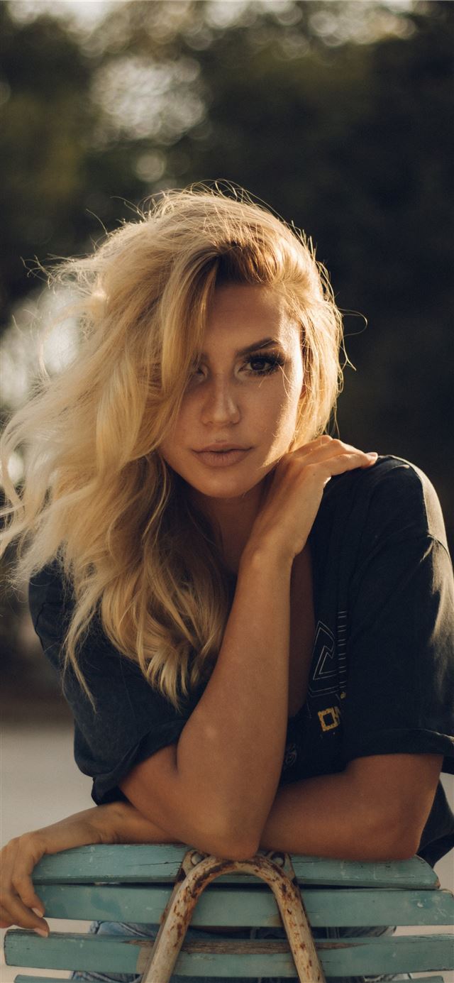 1125x2436 woman wearing black top holding her shoulder - girl iPhone 11 Wallpaper