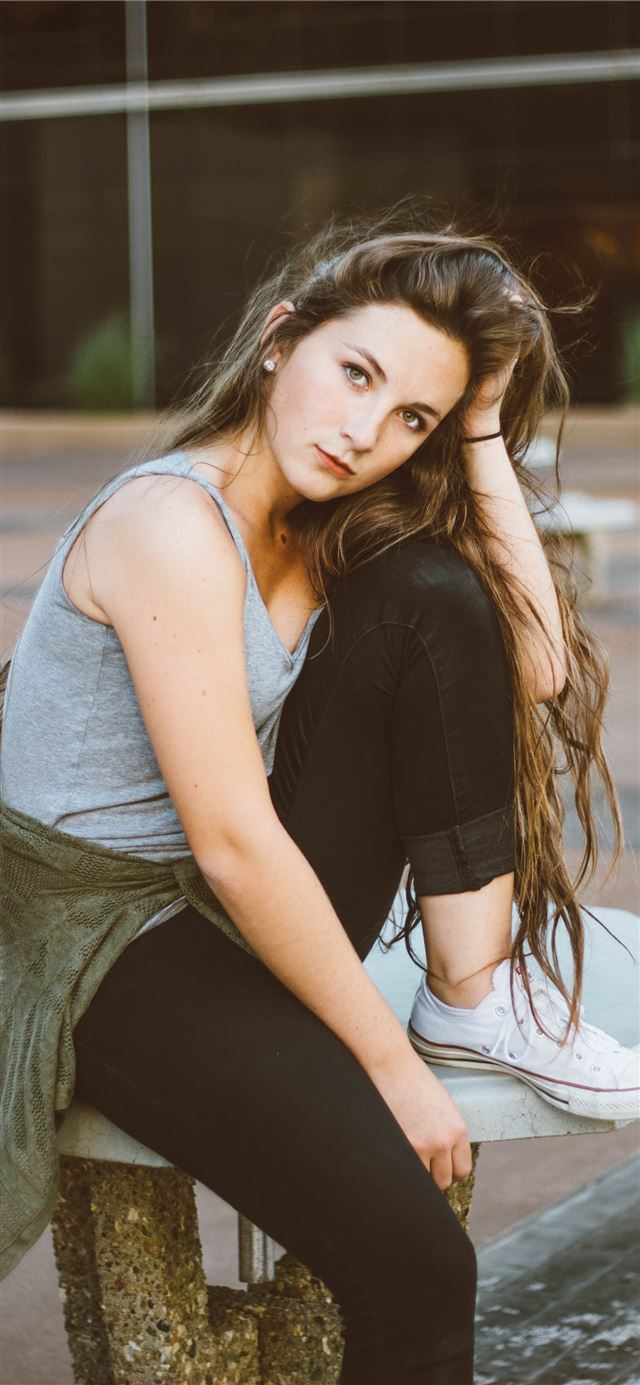 1125x2436 woman sitting on picnic table - girl iPhone 11 Wallpaper