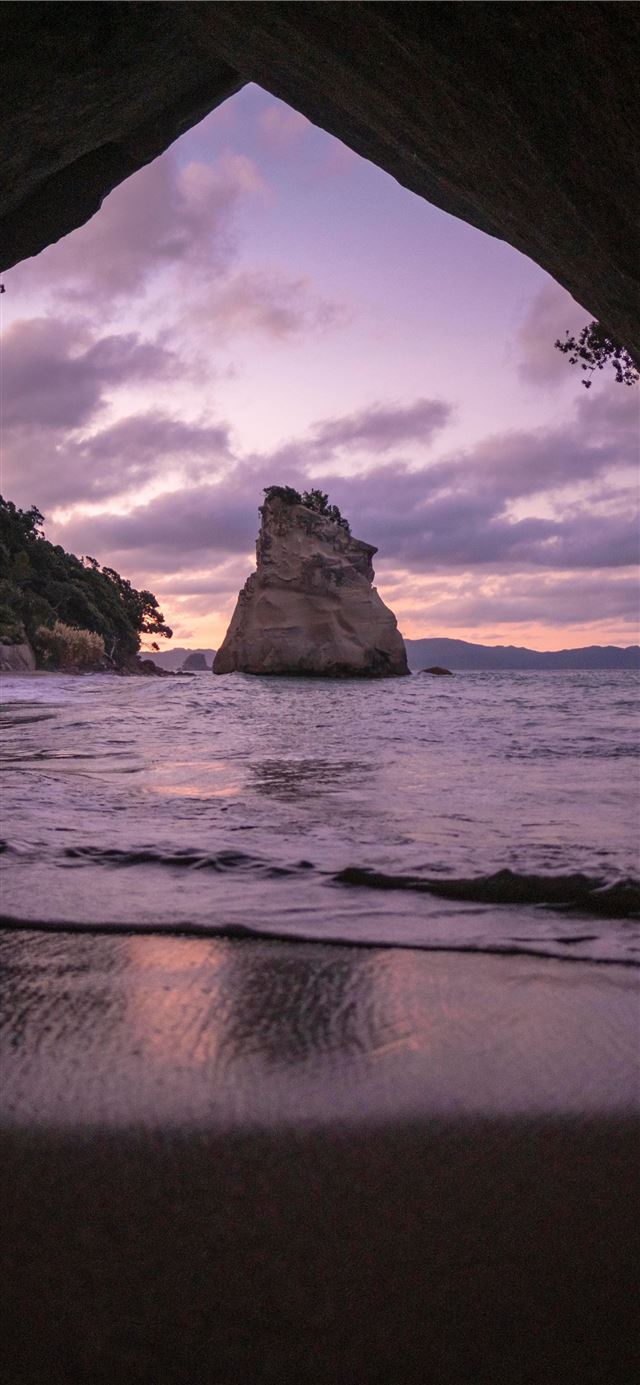 1125x2436 brown cave in front of shoreline - water iPhone 11 Wallpaper