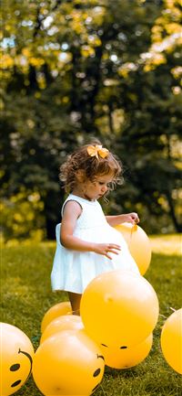 girl wearing white sleeveless dress beside balloon... wallpaper