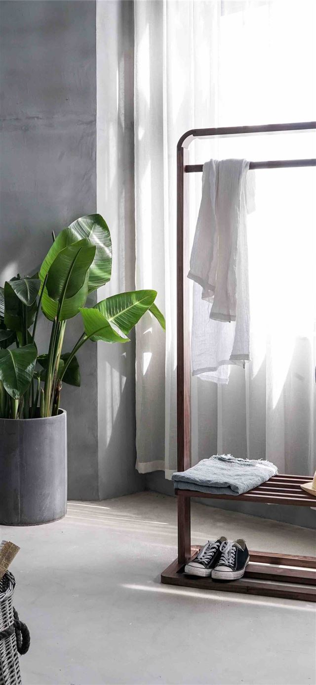 1125x2436 gray dress shirt hang on brown wooden rack in fron... - design iPhone 11 Wallpaper
