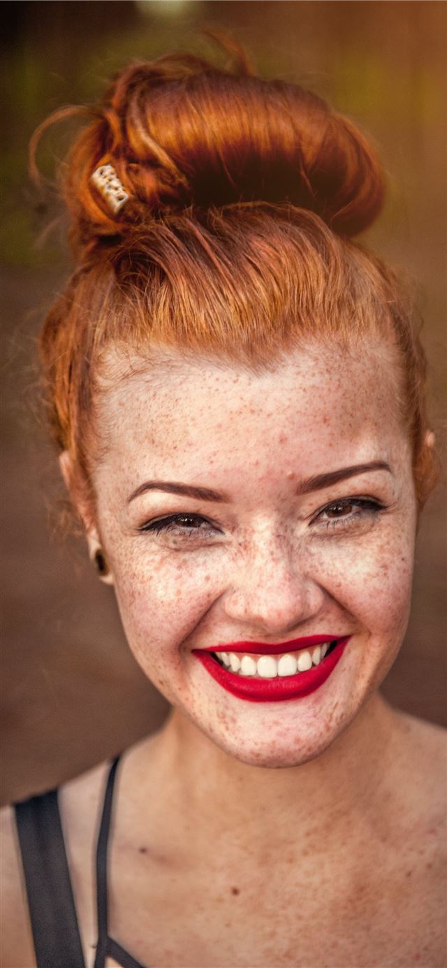 1125x2436 woman taking photo while showing smile - vilhena iPhone 11 Wallpaper