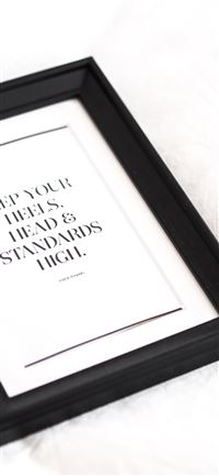 black wooden frame with white text wallpaper