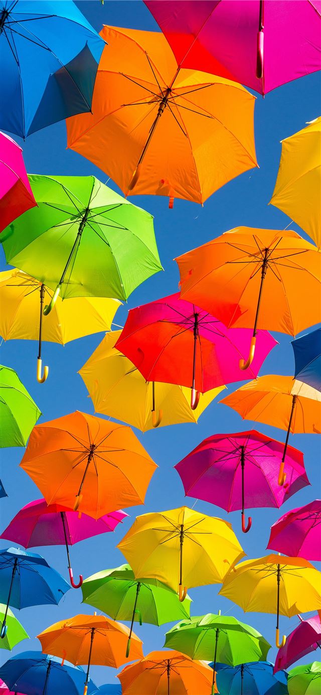 1125x2436 person taking photo of assorted color umbrellas - colorful iPhone 11 Wallpaper