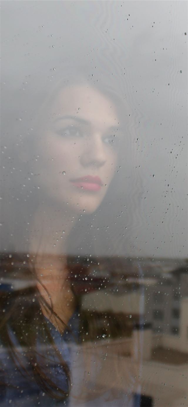 1125x2436 woman looking through window -  iPhone 11 Wallpaper