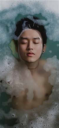 man floating in water wallpaper