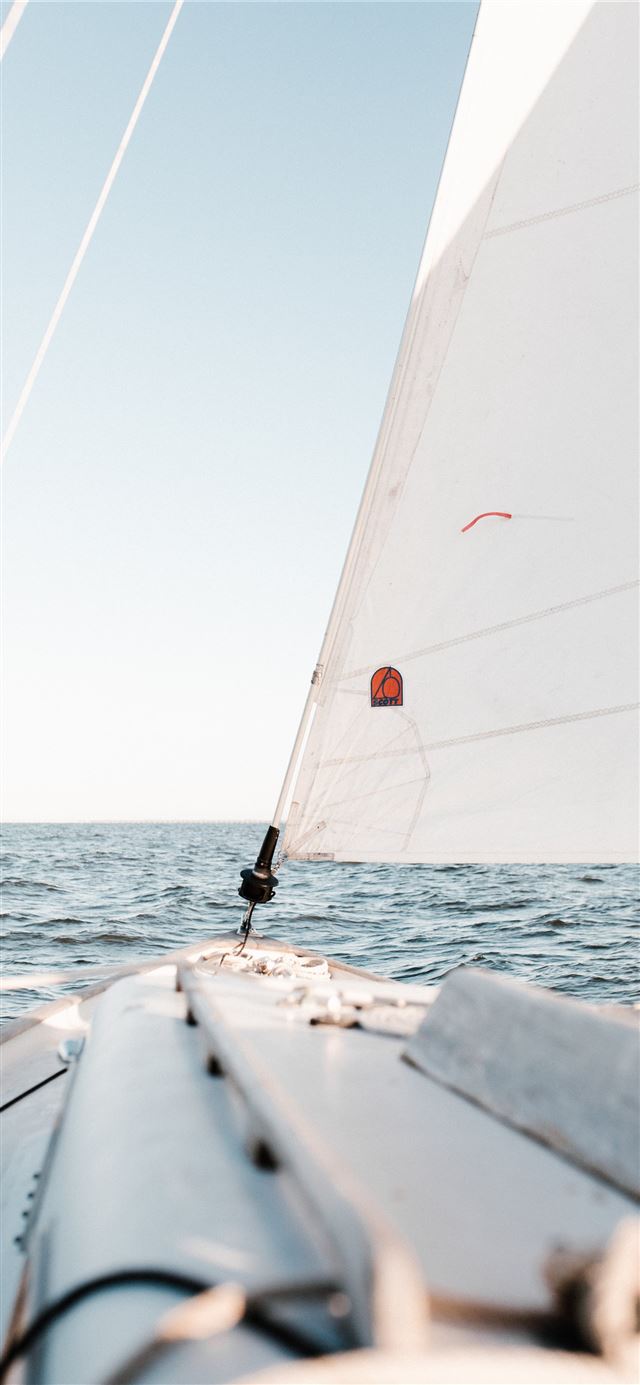 1125x2436 person sailing on ocean - bright iPhone 11 Wallpaper