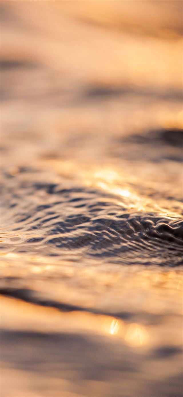 1125x2436 tilt shift photography of sea wave - sunset iPhone 11 Wallpaper
