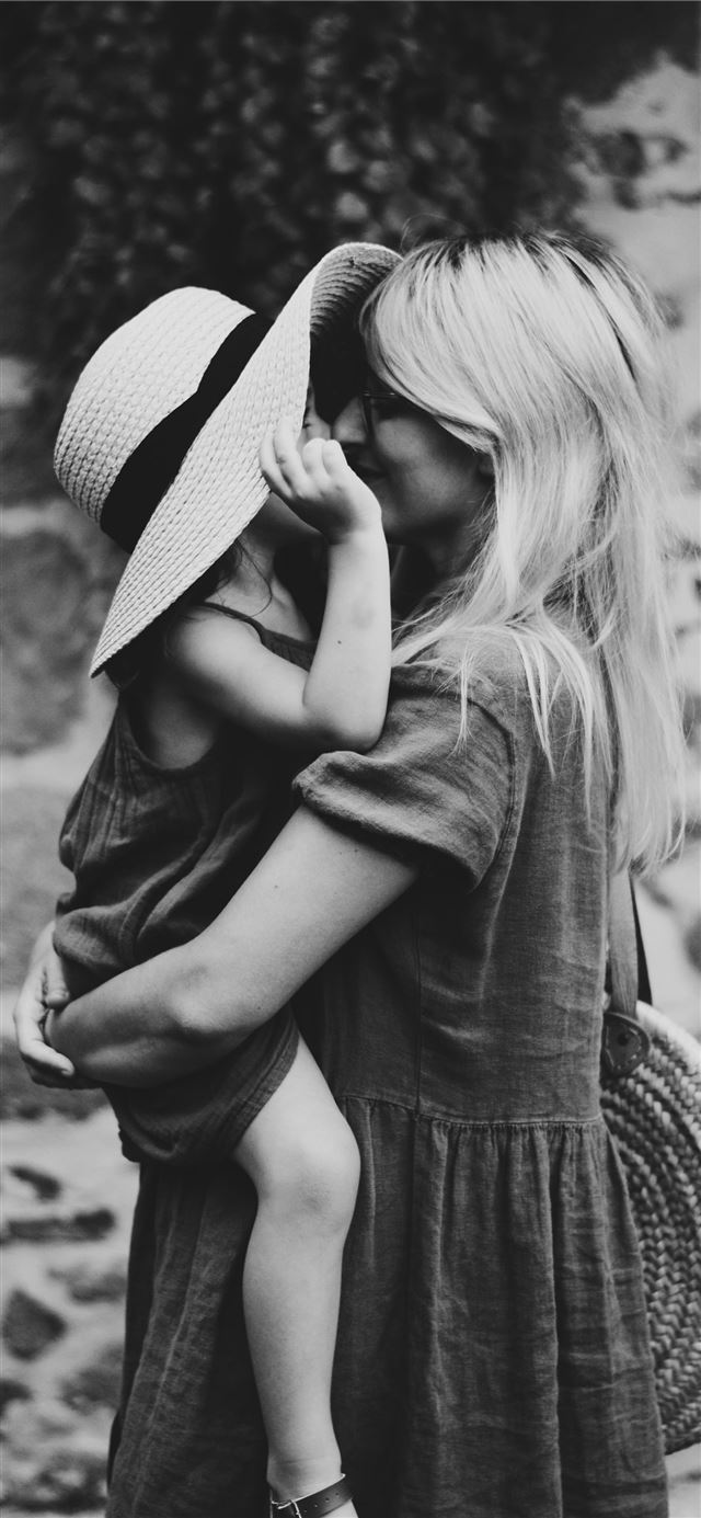 1125x2436 grayscale photography of woman carrying girl - heart iPhone 11 Wallpaper