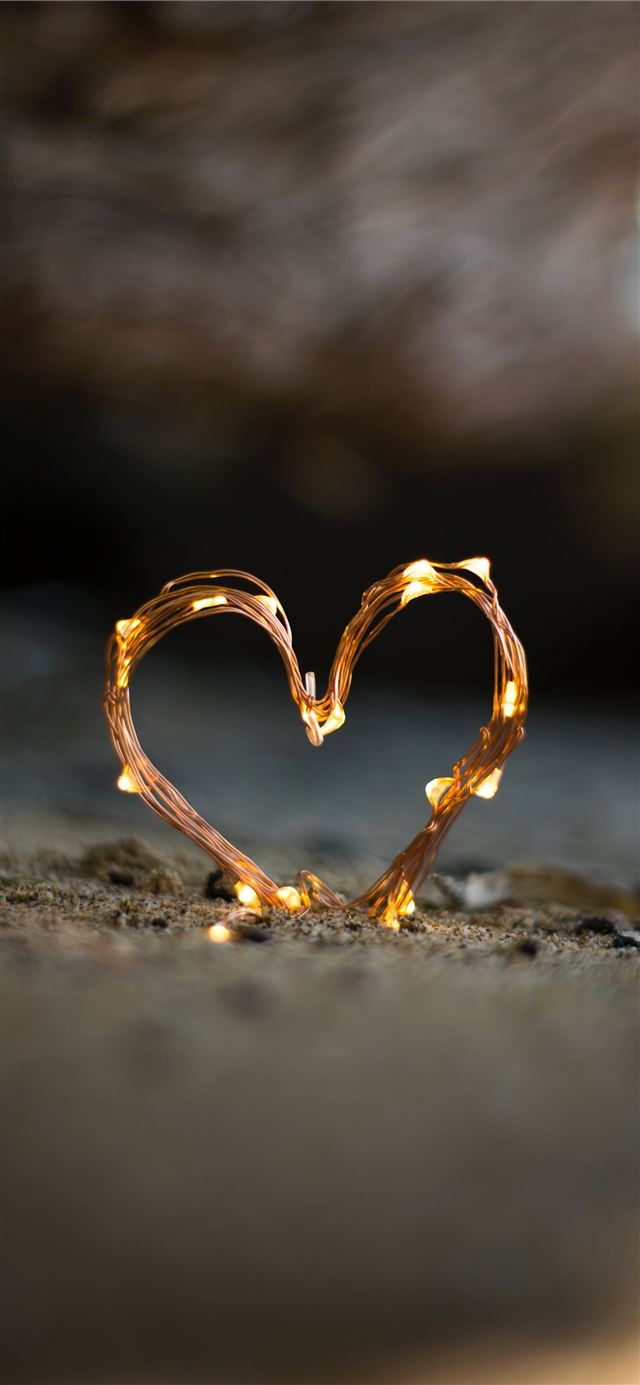 1125x2436 close up photography of heart shaped fairy lite on... - heart iPhone 11 Wallpaper