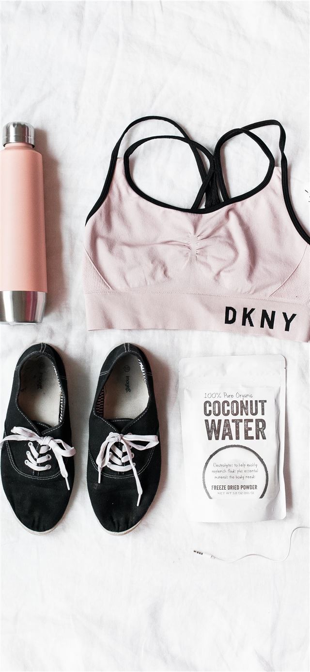 1125x2436 pair of black lace up shoes near DKNY sport bra - pure iPhone 11 Wallpaper