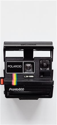 black Polaroid camera with white background wallpaper