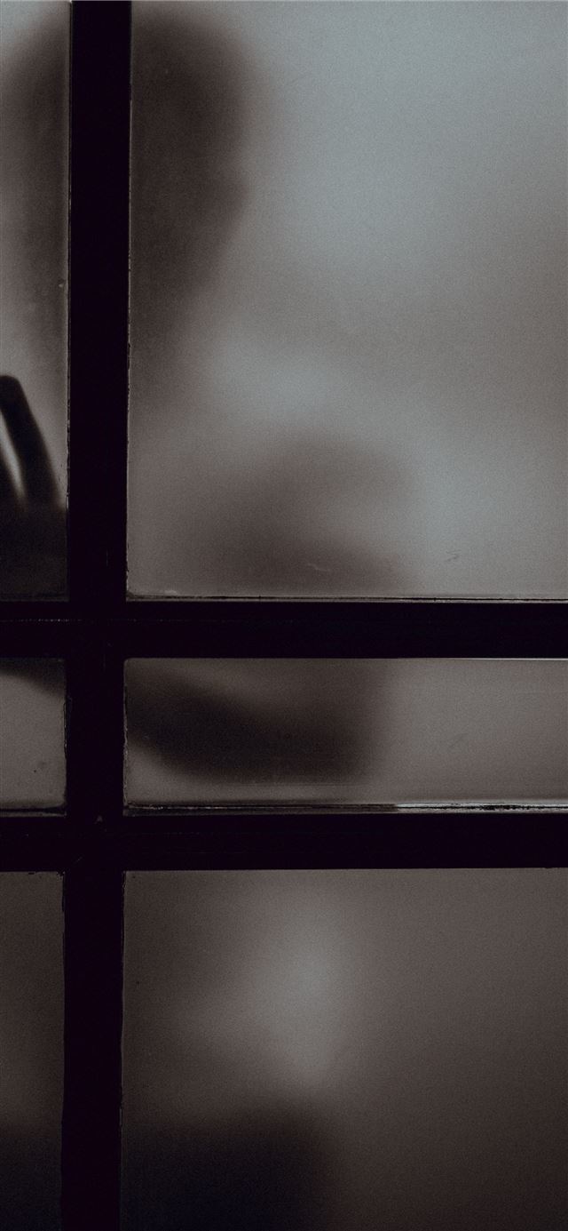 1125x2436 person touching frosted glass door - dark (black) iPhone 11 Wallpaper