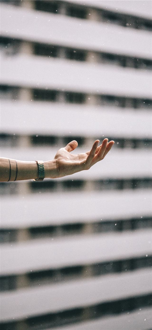 1125x2436 person standing beside building -  iPhone 11 Wallpaper