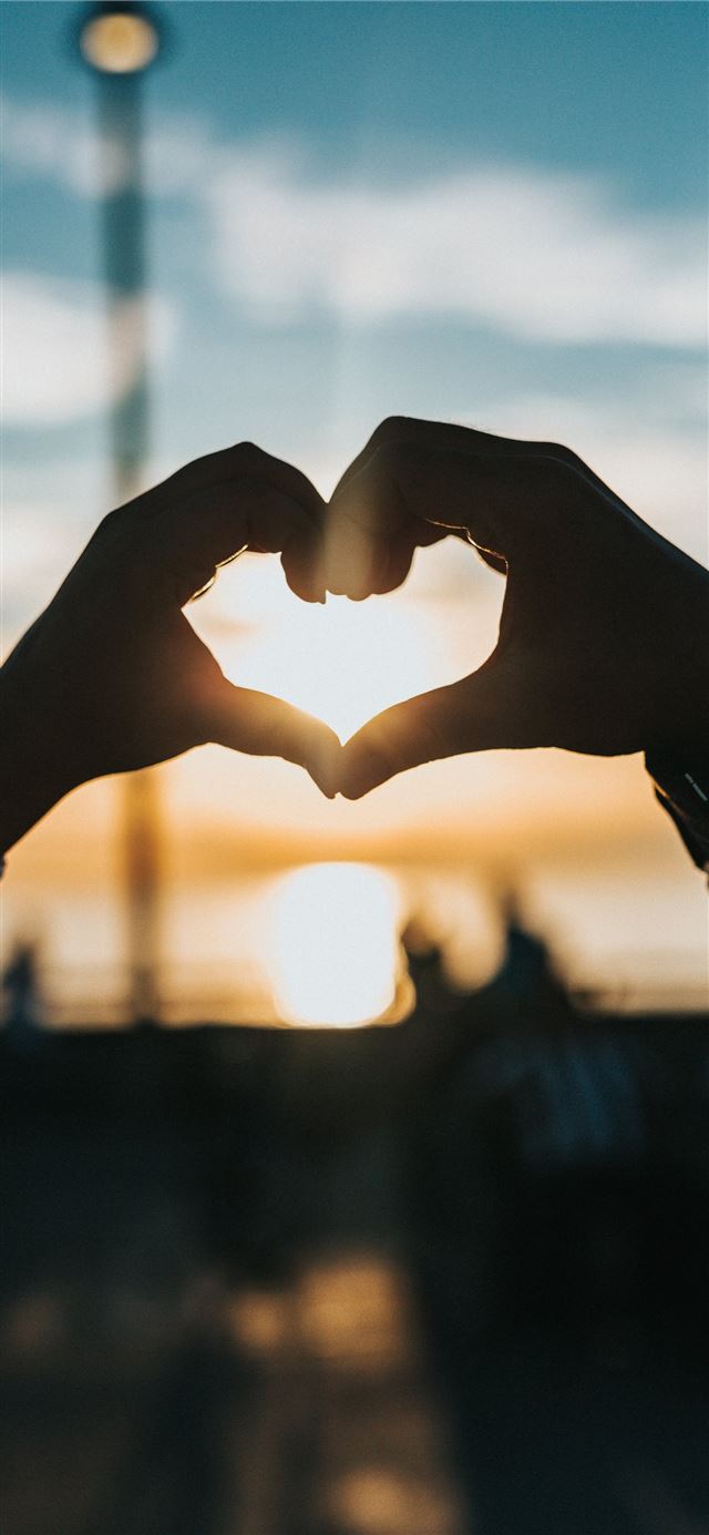 1125x2436 person forming heart with their hands - heart iPhone 11 Wallpaper