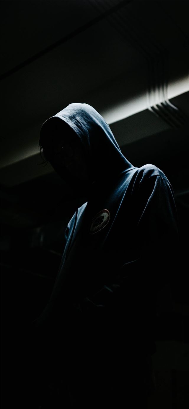 1125x2436 person in black hoodie - dark (black) iPhone 11 Wallpaper
