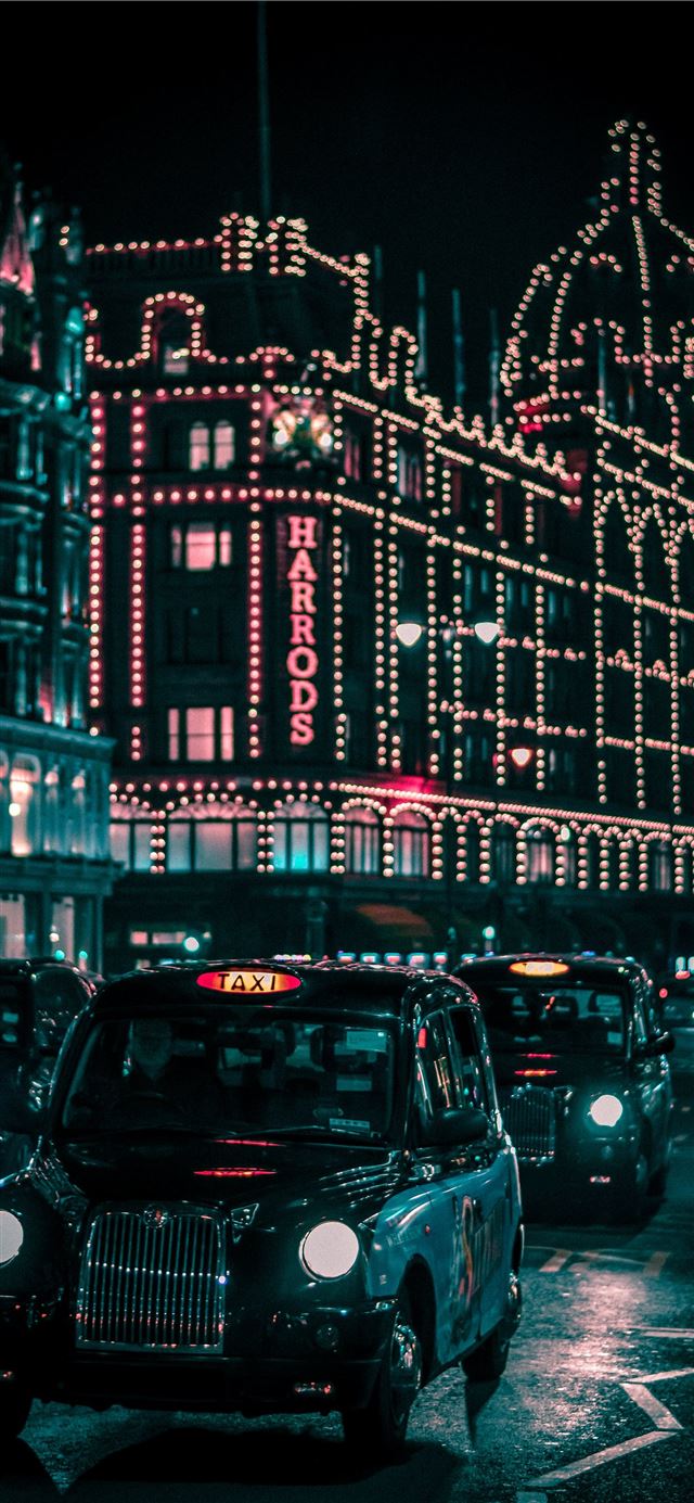1125x2436 black taxi in the street passing trough Harrods Ma... - city iPhone 11 Wallpaper