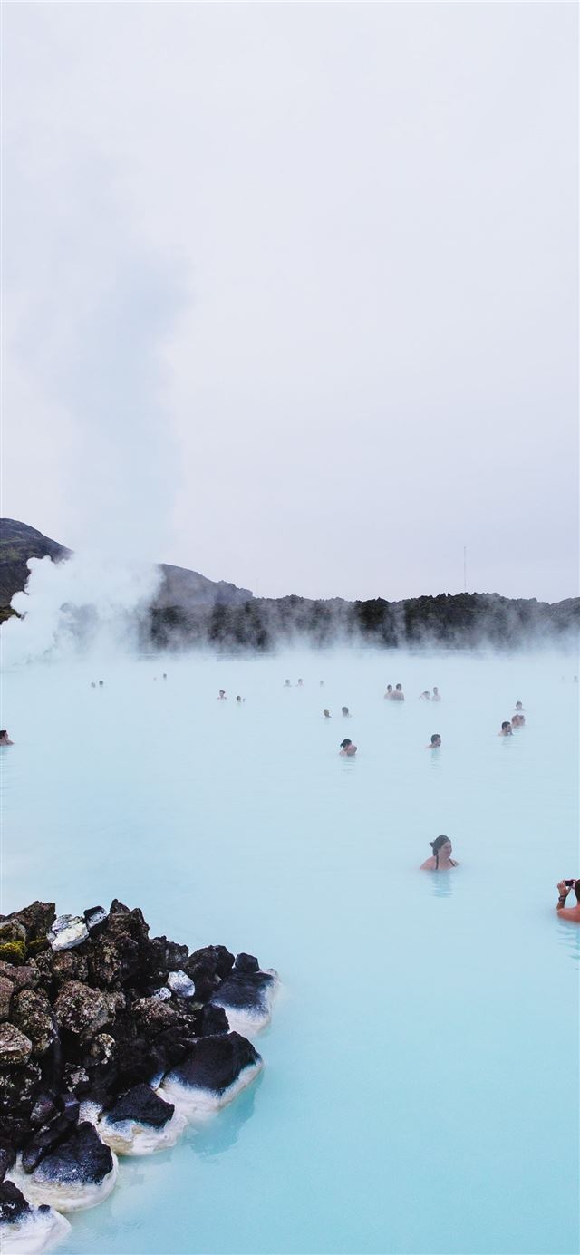 1125x2436 people swimming on hot spring near mountain during... - lake iPhone 11 Wallpaper