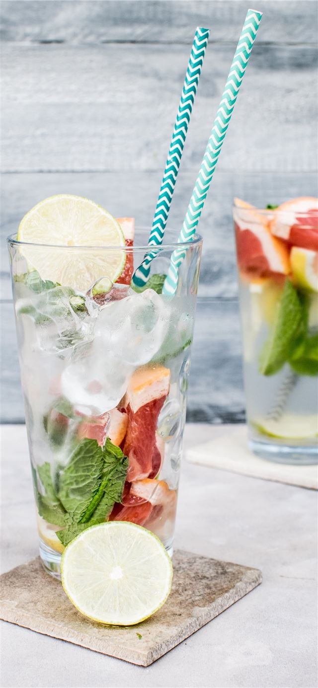 1125x2436 two filled drinking glasses with beverages - water iPhone 11 Wallpaper