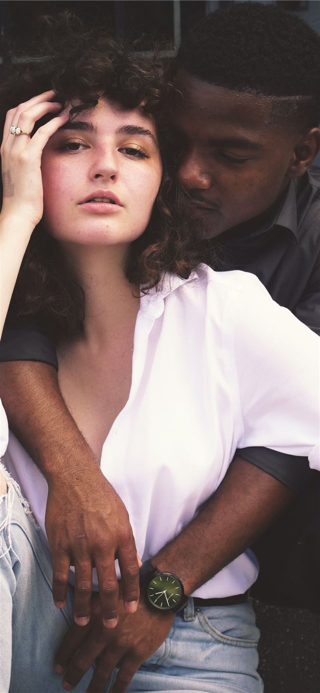 1125x2436 man hugging woman while taking photo of each other - love iPhone 11 Wallpaper