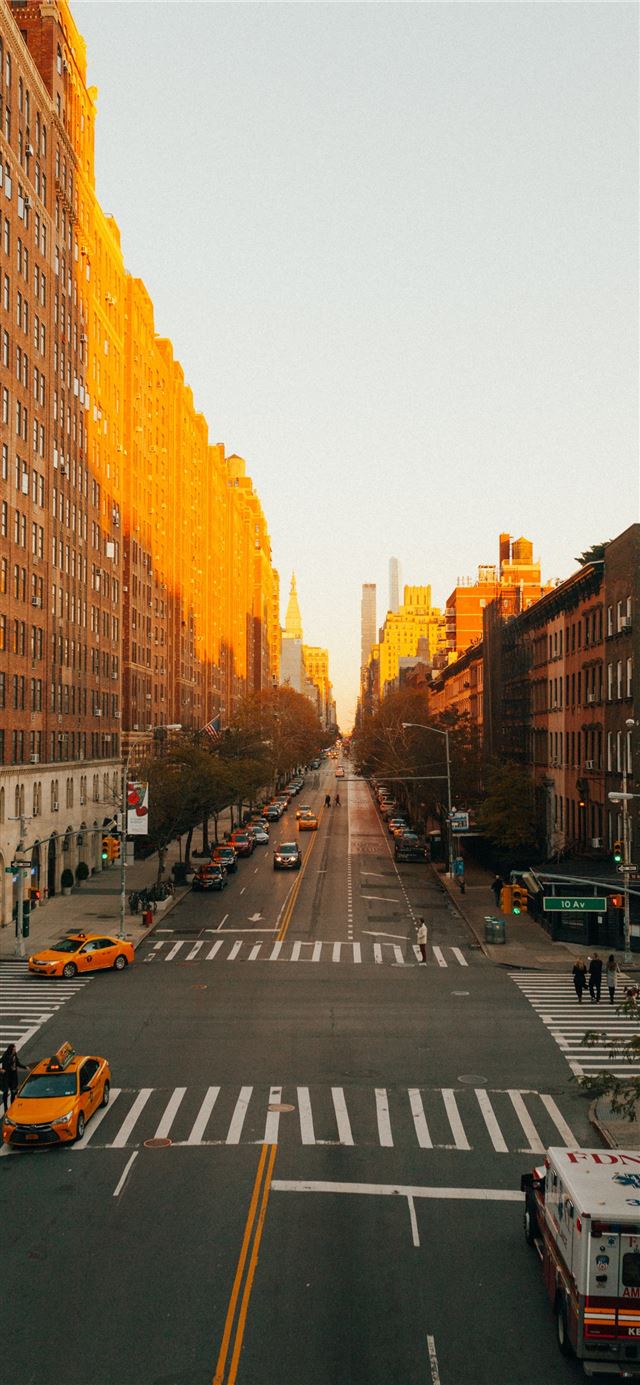 1284x2778 concrete road beside building during golden hour -  iPhone 11 Wallpaper