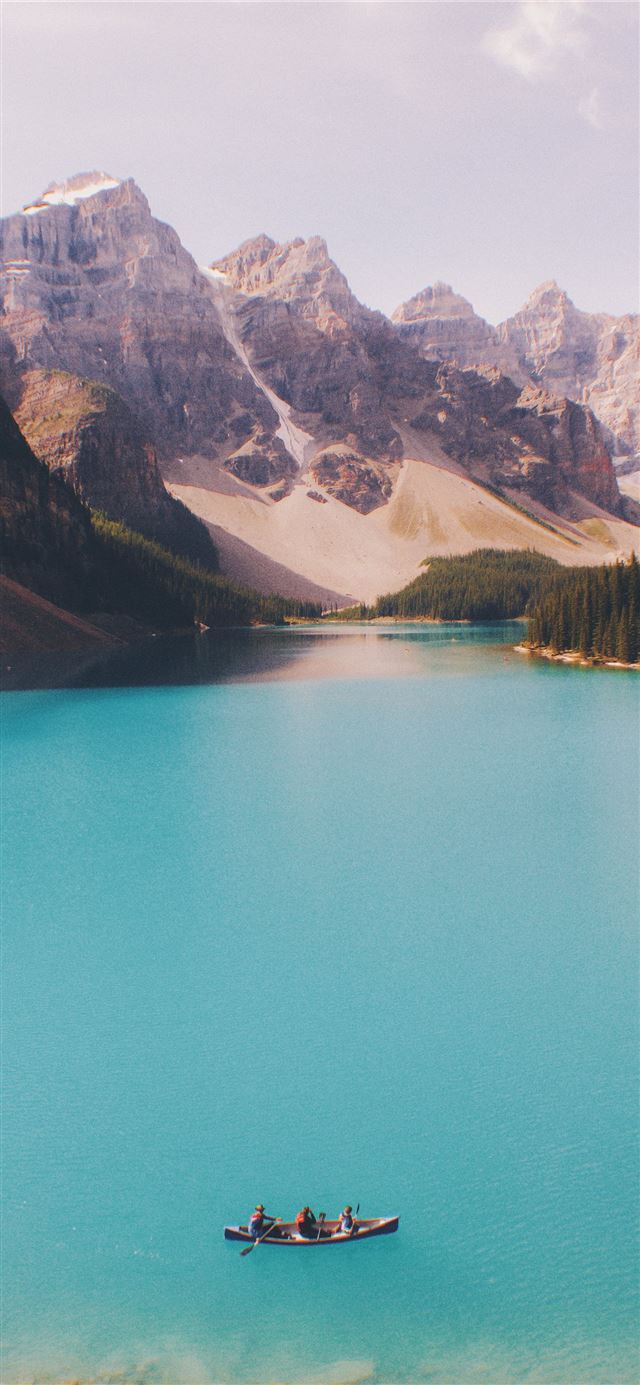 1125x2436 three people paddling in canoe -  iPhone 11 Wallpaper