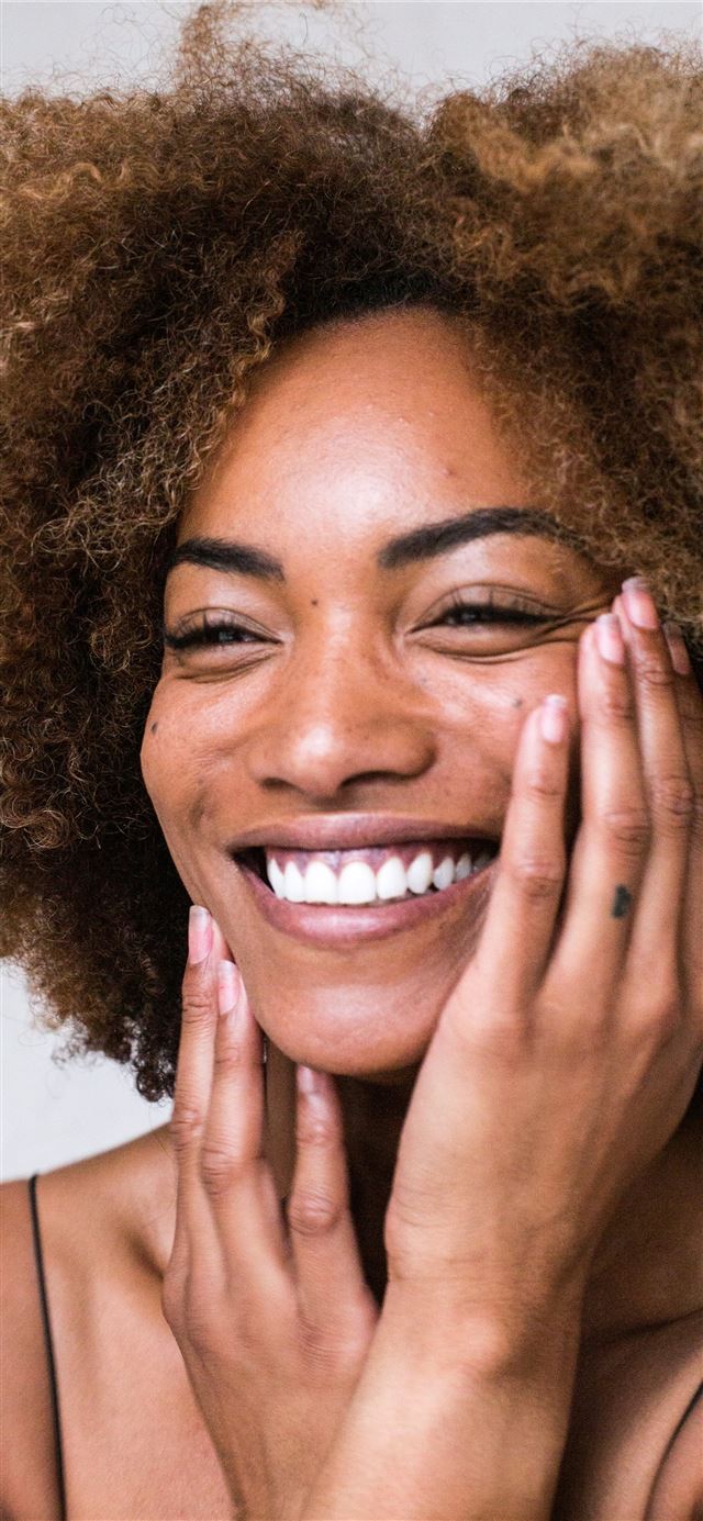 1125x2436 smiling woman with brown hair -  iPhone 11 Wallpaper