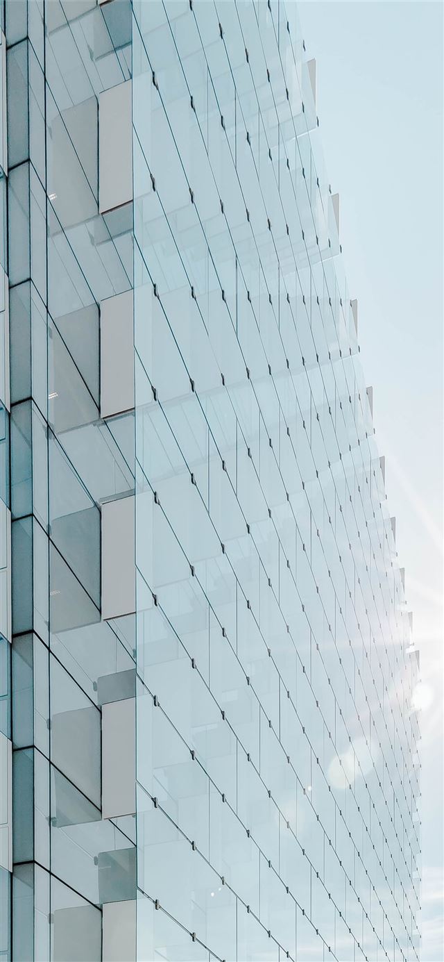 1125x2436 glass panel high rise building under blue sky with... -  iPhone 11 Wallpaper