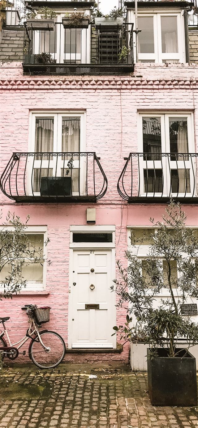 1125x2436 bicycle beside pink wall -  iPhone 11 Wallpaper