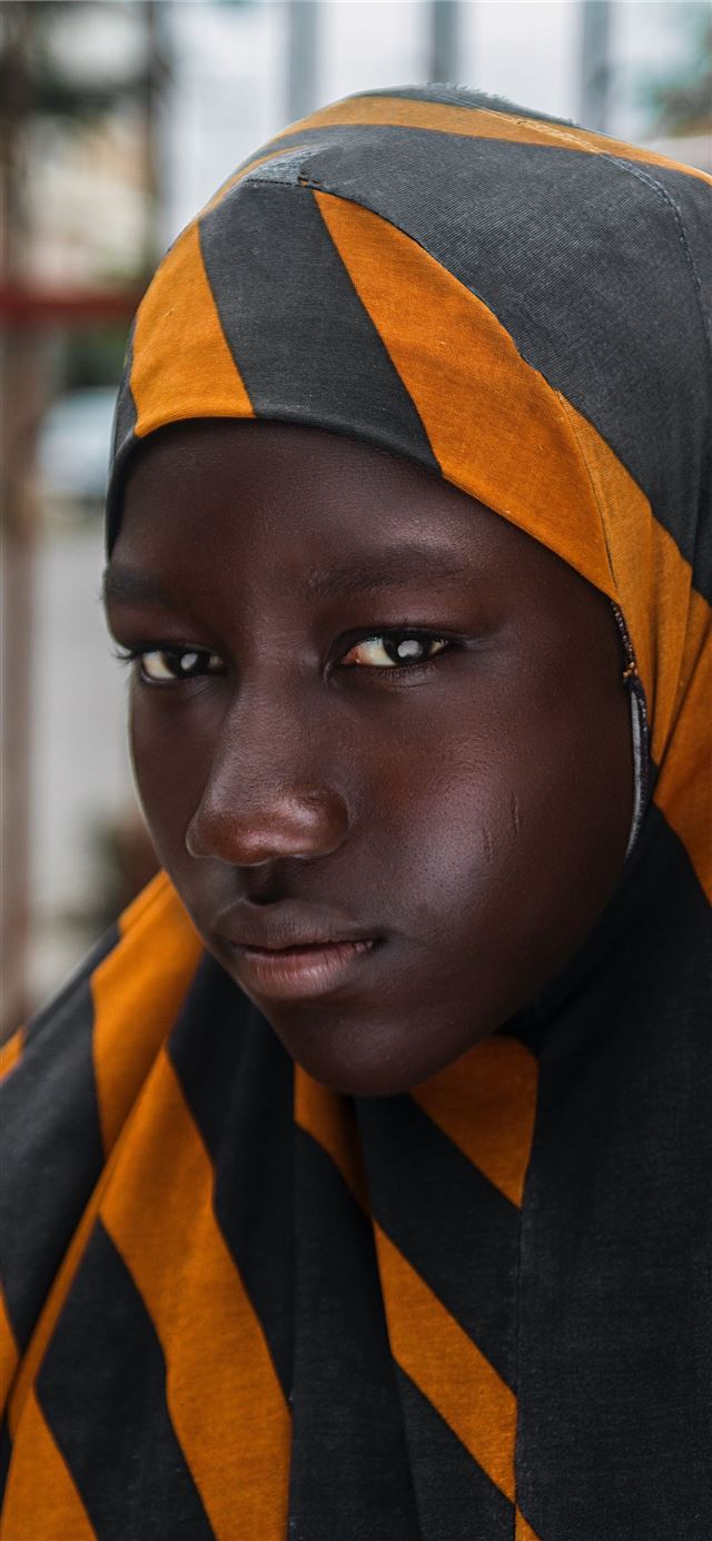 1125x2436 girl in black and orange striped head scarf in sel... -  iPhone 11 Wallpaper
