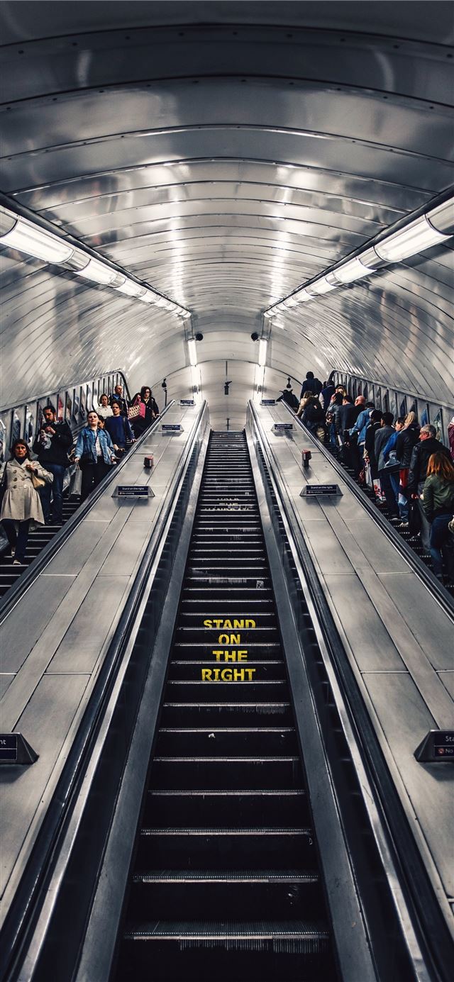 1284x2778 people riding escalator -  iPhone 11 Wallpaper