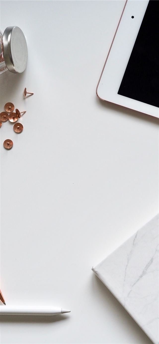 1125x2436 photo of thumbtacks near iPad -  iPhone 11 Wallpaper