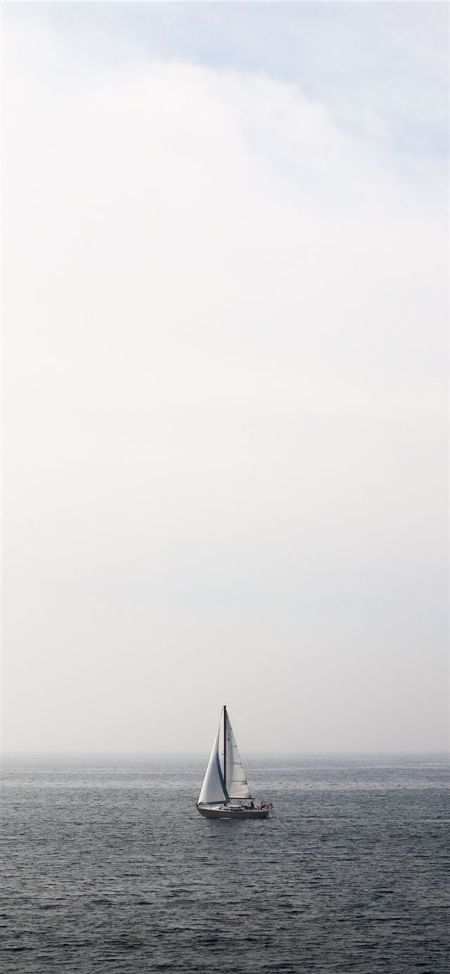 1125x2436 boat sailing in body of water -  iPhone 11 Wallpaper