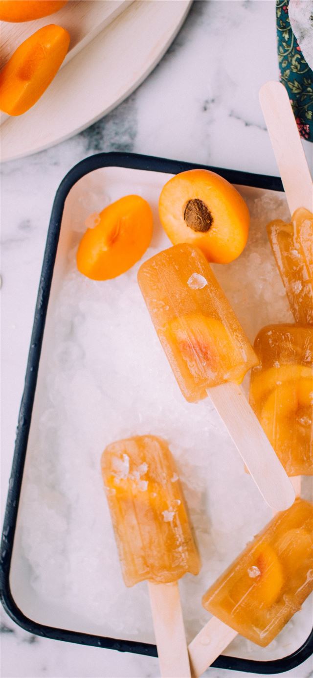 1125x2436 flat lay photography of ice cream popsicles -  iPhone 11 Wallpaper