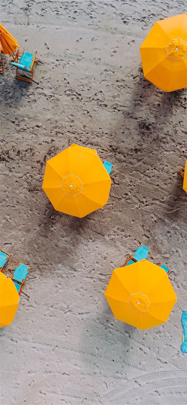 1125x2436 five yellow umbrellas on sand at daytime -  iPhone 11 Wallpaper