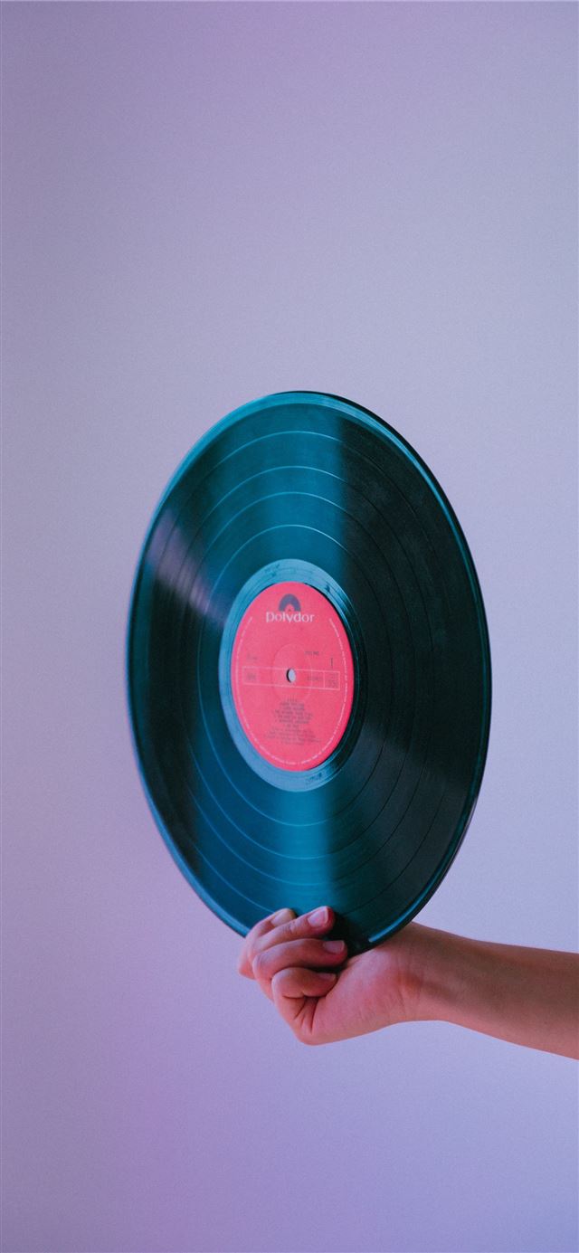 1125x2436 person holding vinyl record -  iPhone 11 Wallpaper