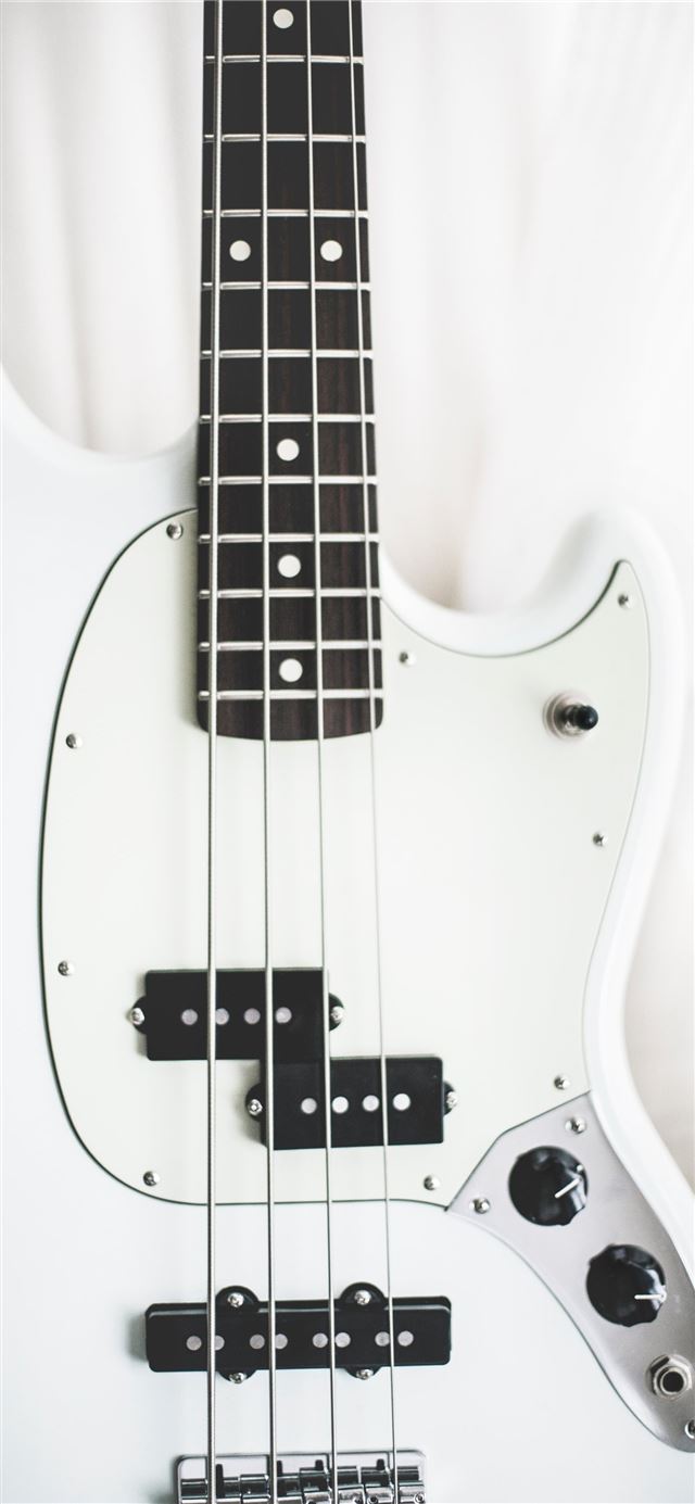 1284x2778 white and black electric bass guitar on white surf... -  iPhone 11 Wallpaper
