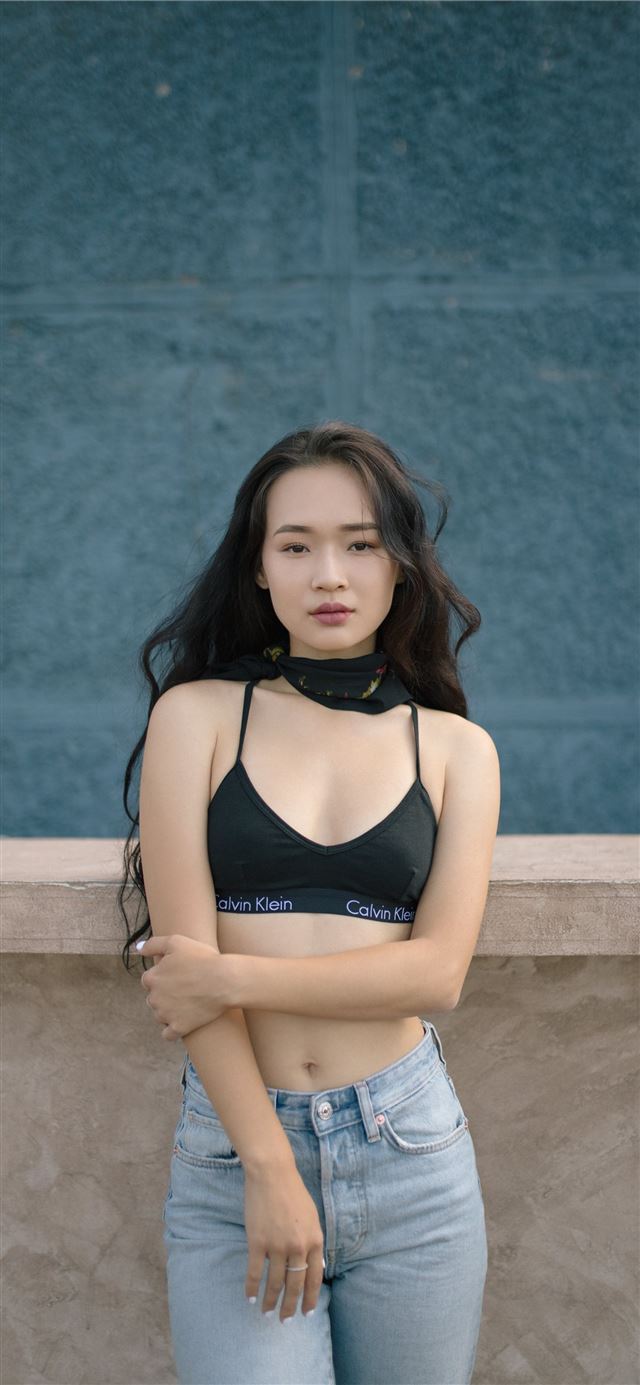 1125x2436 woman standing in front of wall -  iPhone 11 Wallpaper