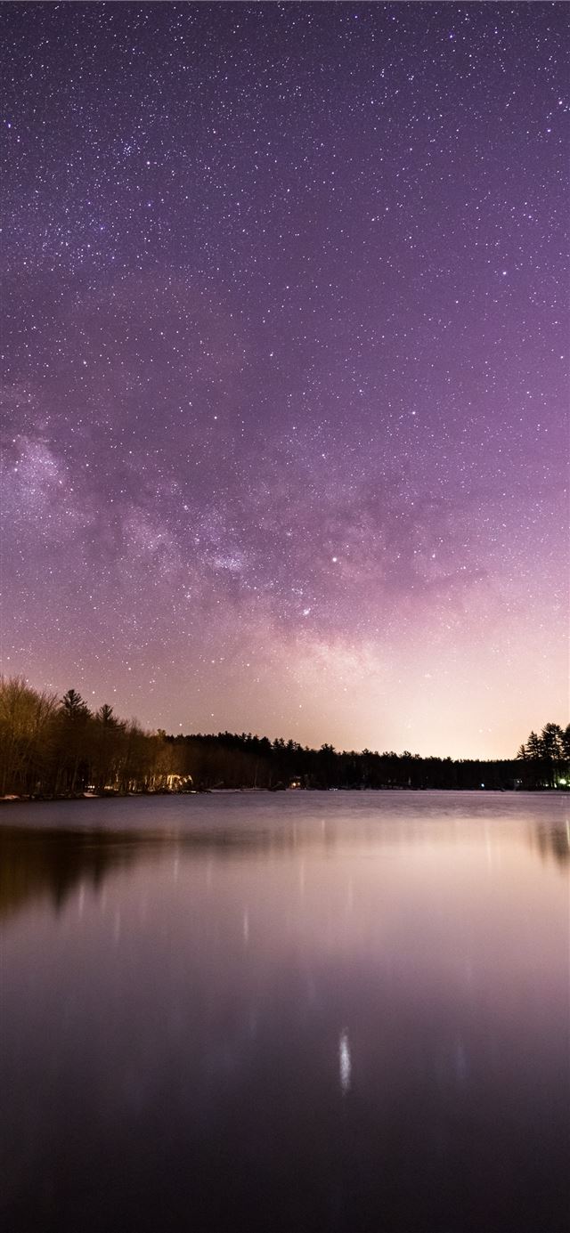 1284x2778 calm body of water overlooking trees under milky w... -  iPhone 11 Wallpaper